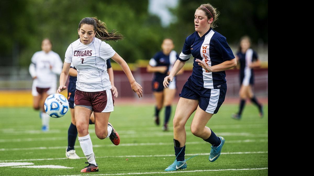 
Golden Valley junior Kelly Chavez (7) races toward the ball during a game against Cosumnes Oaks at Golden Valley High School in Merced, Calif., Thursday, May 7, 2015. The Wolfpack beat the Cougars 3-1.
