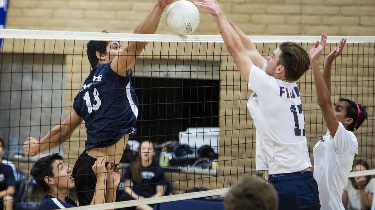Stone Ridge Christian junior Jonathan Collazo (18) attempts to tip the ball past Vacaville Christian senior Jeremy Botkin (17) during a game against Vacaville Christian at Stone Ridge Christian High School in Merced, Calif., Tuesday, May 10, 2016.