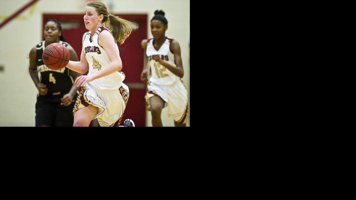 
Golden Valley junior Stephanie Moore (4) races up the court during a game against Buhach Colony at Golden Valley High School in Merced, Calif., Tuesday, Jan. 13, 2015. The Cougars beat the Thunder 58-26.
