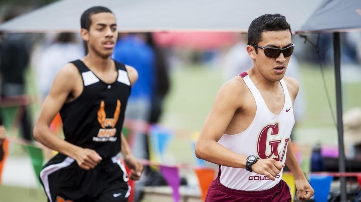 Golden Valley High School senior Guillermo Rivas, right, leads Merced's Julian Johnson, left, and the rest of the field during the boys 3200 meter race during the Central California Conference track meet at Atwater High School in Atwater, Calif., Saturday, May 7, 2016.