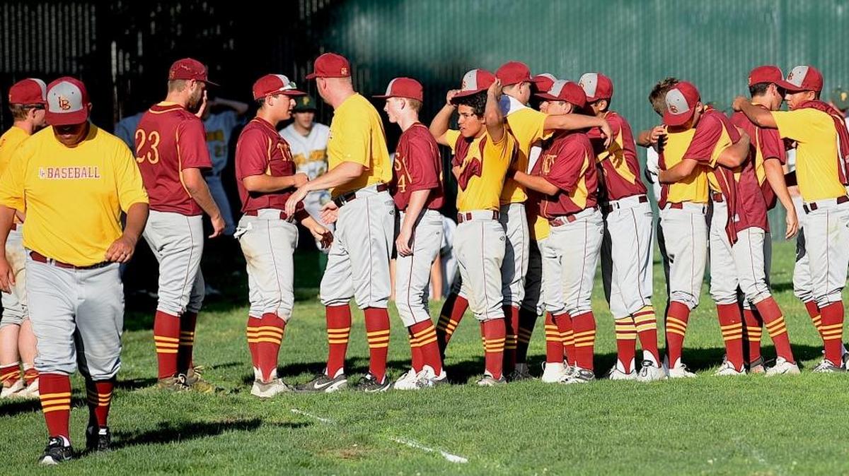 Los Banos players hug and shake hands after a season-ending playoff loss to Bear River on Wednesday night. Wednesday, May 18, 2016 in Lodi.