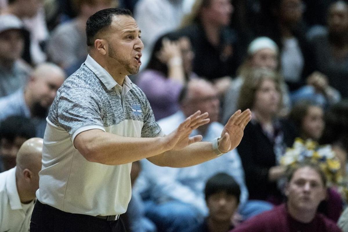 El Capitan head coach Adrian Hurtado calls out to his players during a game against Merced at El Capitan High School in Merced, Calif., on Friday, Feb. 2, 2018. The Gauchos beat the Bears 63-61 in double overtime.