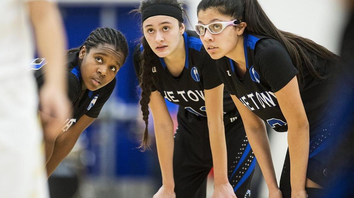 Atwater sophomore Amoni Claiborne (32), left, senior Lexi Valencia (11), center, and senior Marisa Martinez (3), right, talk things over during a game against Buhach Colony earlier this season. The Falcons can clinch the outright CCC title against the Thunder at Buhach Colony on Thursday.
