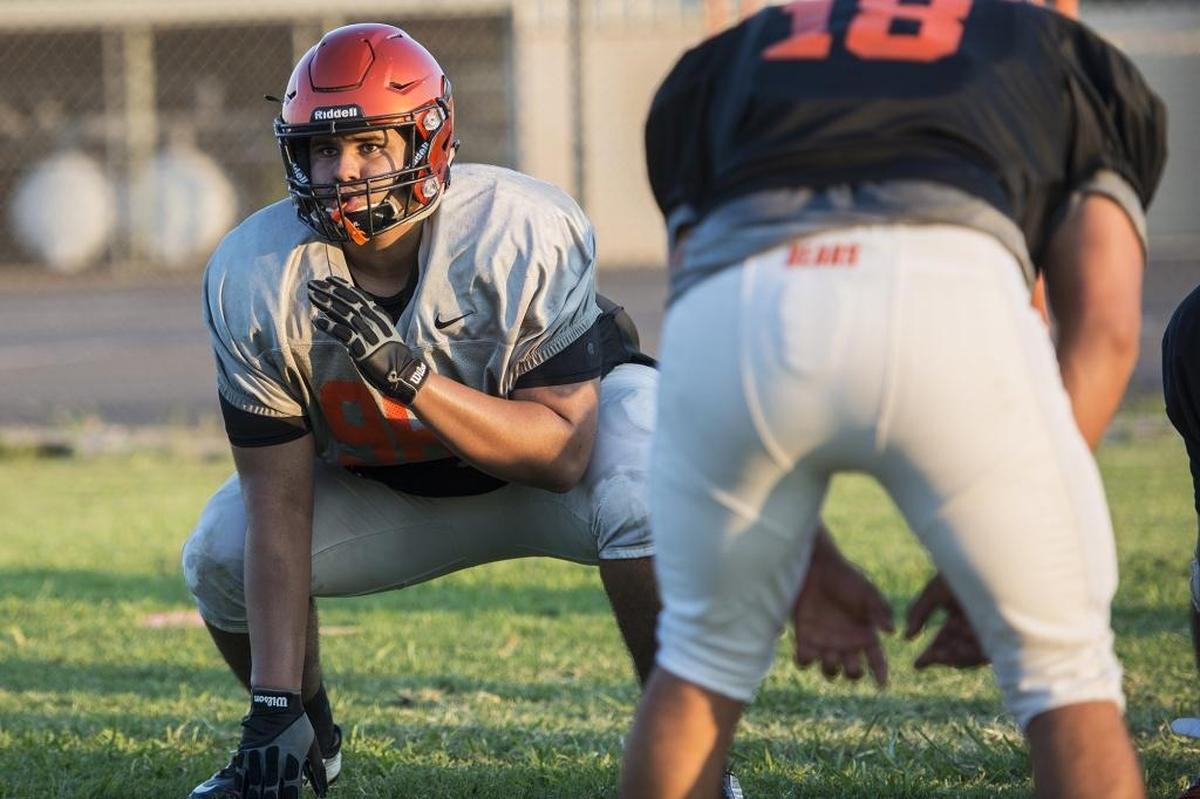 Merced’s Anthony Davis runs through drills during football practice at Merced High School in Merced, Calif., on Wednesday, Aug. 1, 2018.
