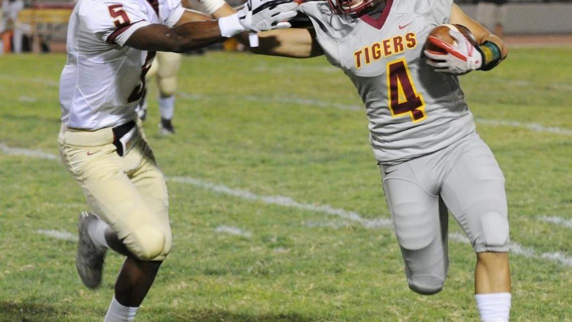 Los Banos High running back Antonio Lopez runs past Golden Valley Rodney Winzer in the second quarter Fri., Sept. 8, 2017 in Los Banos at Loftin Stadium.