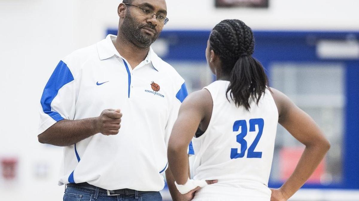 Atwater head coach JR Davis speaks to Atwater freshman Amoni Claiborne (32) during a game against Turlock at Atwater High School in Atwater, Calif., on Tuesday, Jan. 30, 2018.
