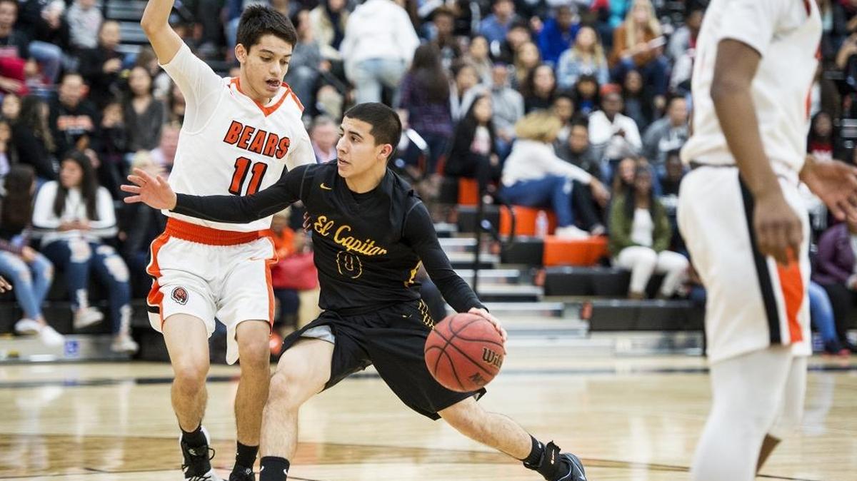 El Capitan senior Angel Serena (0) attempts to get past Merced senior Anthony Robinson (11) during a game at Merced High School in Merced, Calif., on Wednesday, Jan. 10, 2018. The Gauchos beat the Bears 60-53.