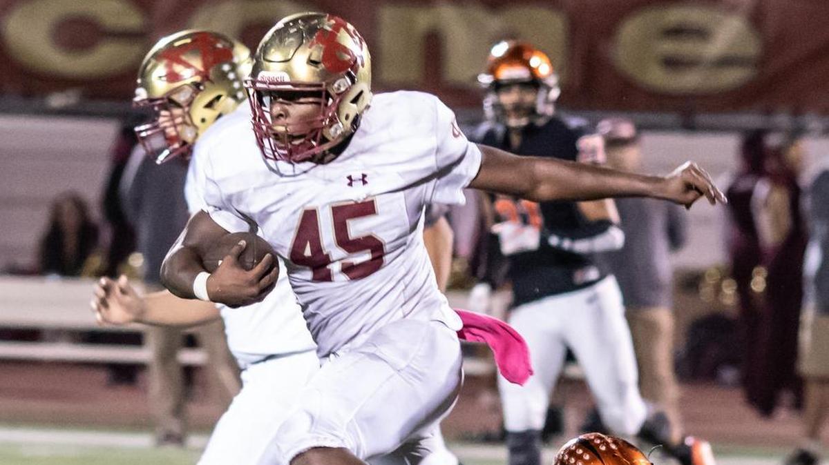 Golden Valley running back Davon Johnson runs through a tackle during Friday night’s 25th annual Battle for the Mayor’s Cup. Johnson rushed for 106 yards for the Cougars.
