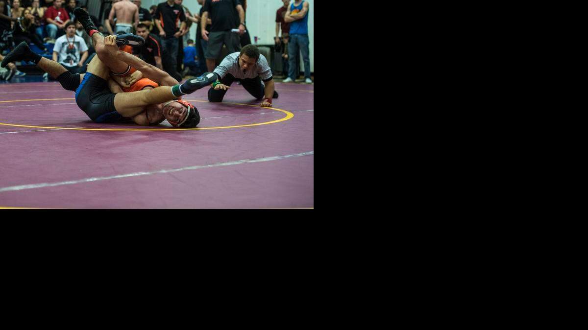 
Merced’s Romeo Medina, wrestles against Atwater’s Johnny Juarez in last week’s Central California Conference 152-pound final. Medina is looking to advance from this week’s Sac-Joaquin Section Division I-AA Tournament at Del Oro High School.
