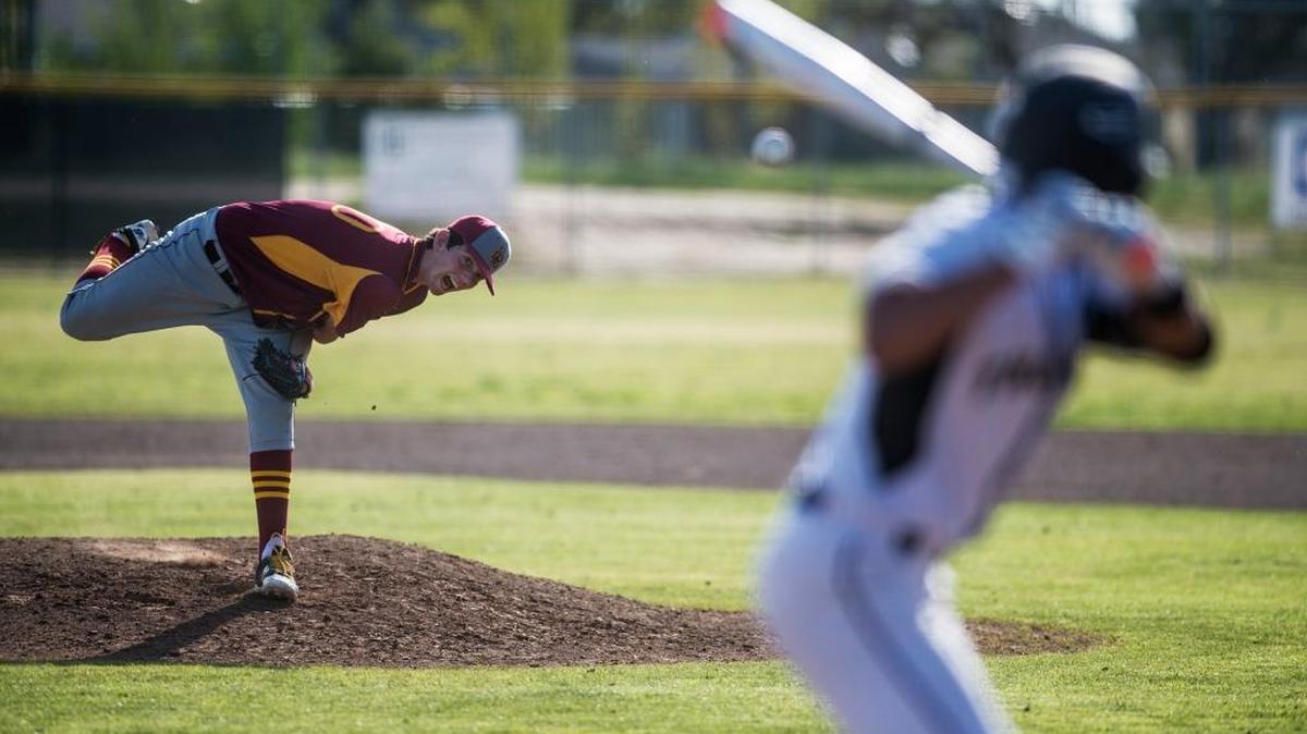 Los Banos freshman pitcher Kody Cardoza (20) delivers a pitch during a game against Buhach Colony at Buhach Colony High School in Atwater on Friday, March 18, 2016. The Tigers beat the Thunder 2-1.