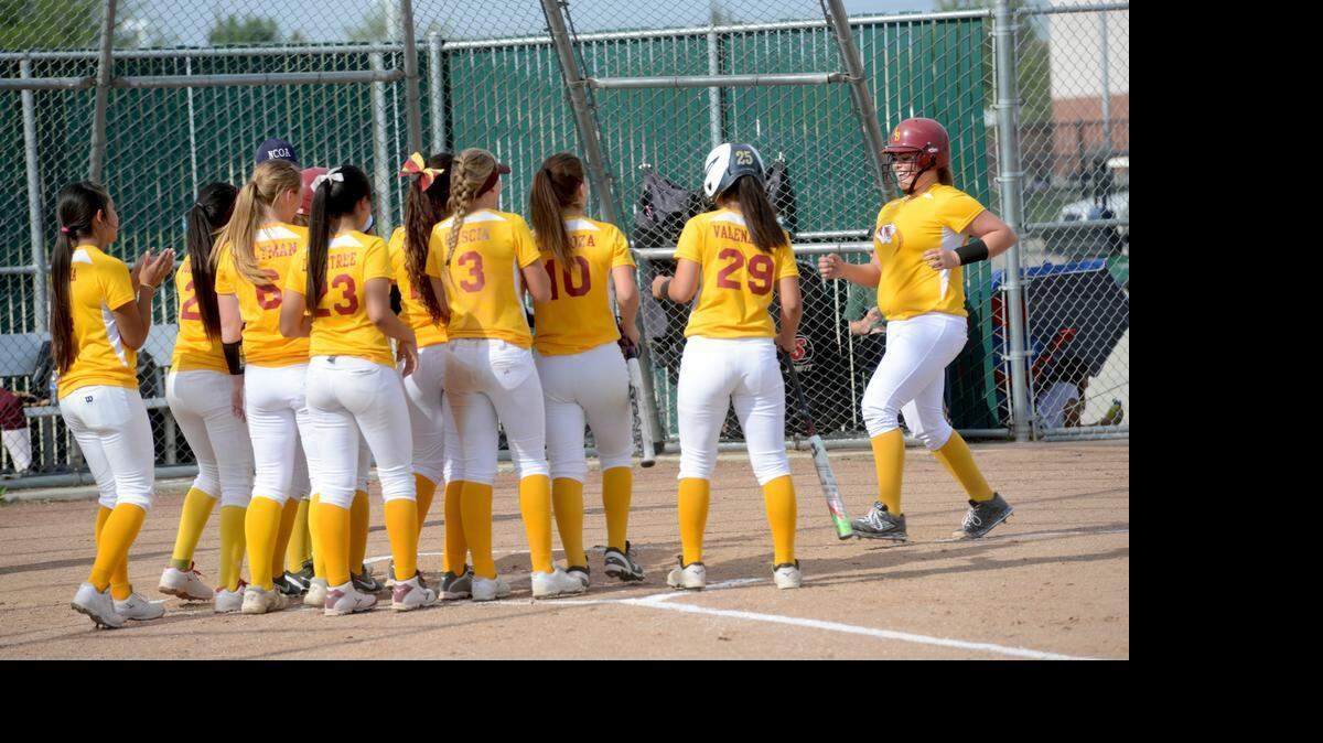 
Teammates greet Los Banos' Brianna Flores at the plate after her two-run home run in the second inning of Monday's 14-3 victory over Central Valley.

