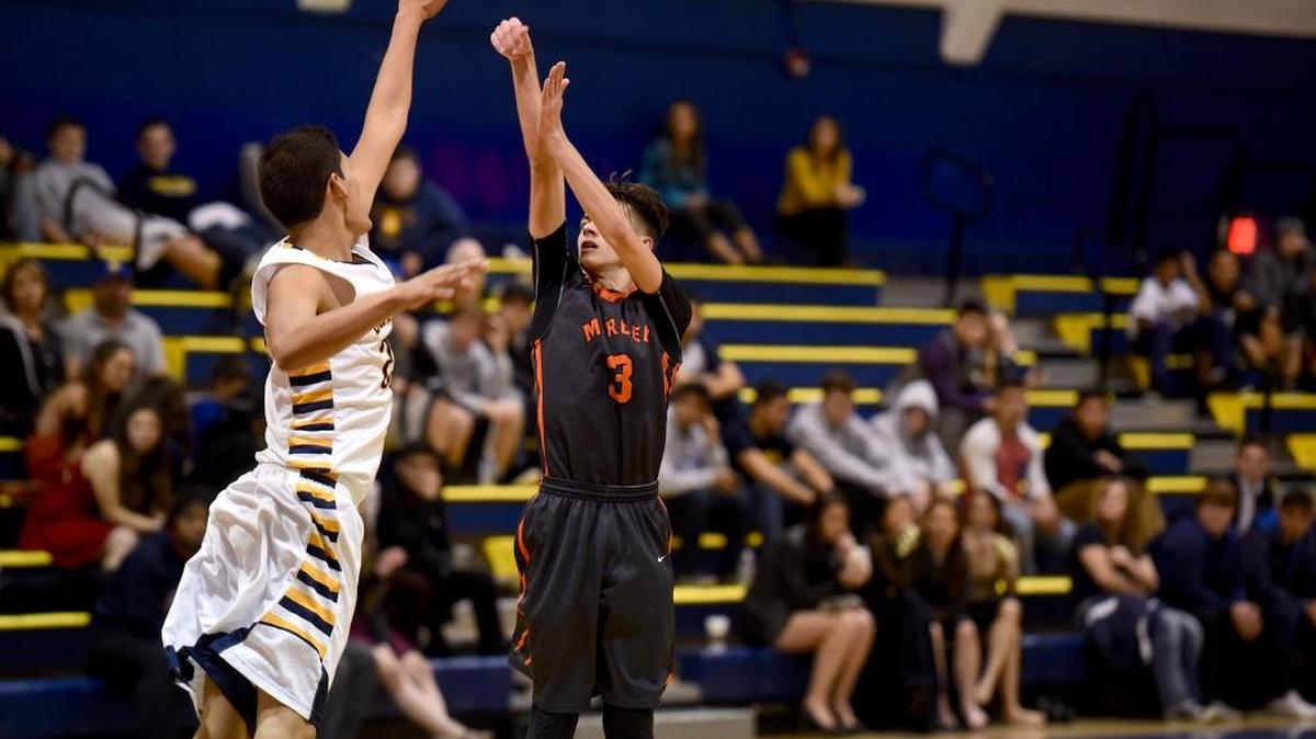 Merced guard Jared Pazin (3) shoots a jumper over Turlock's Habib Velasquez. Friday Jan. 29, 2016 in Turlock.