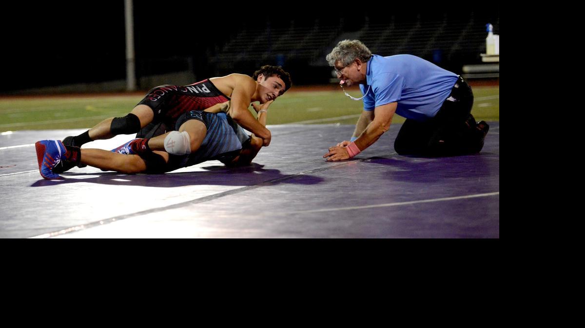 
Golden Valley’s Daniel Carlin, left, records a near fall on El Capitan’s Nate Gonzalez  at Pin Cancer on Monday night. 
