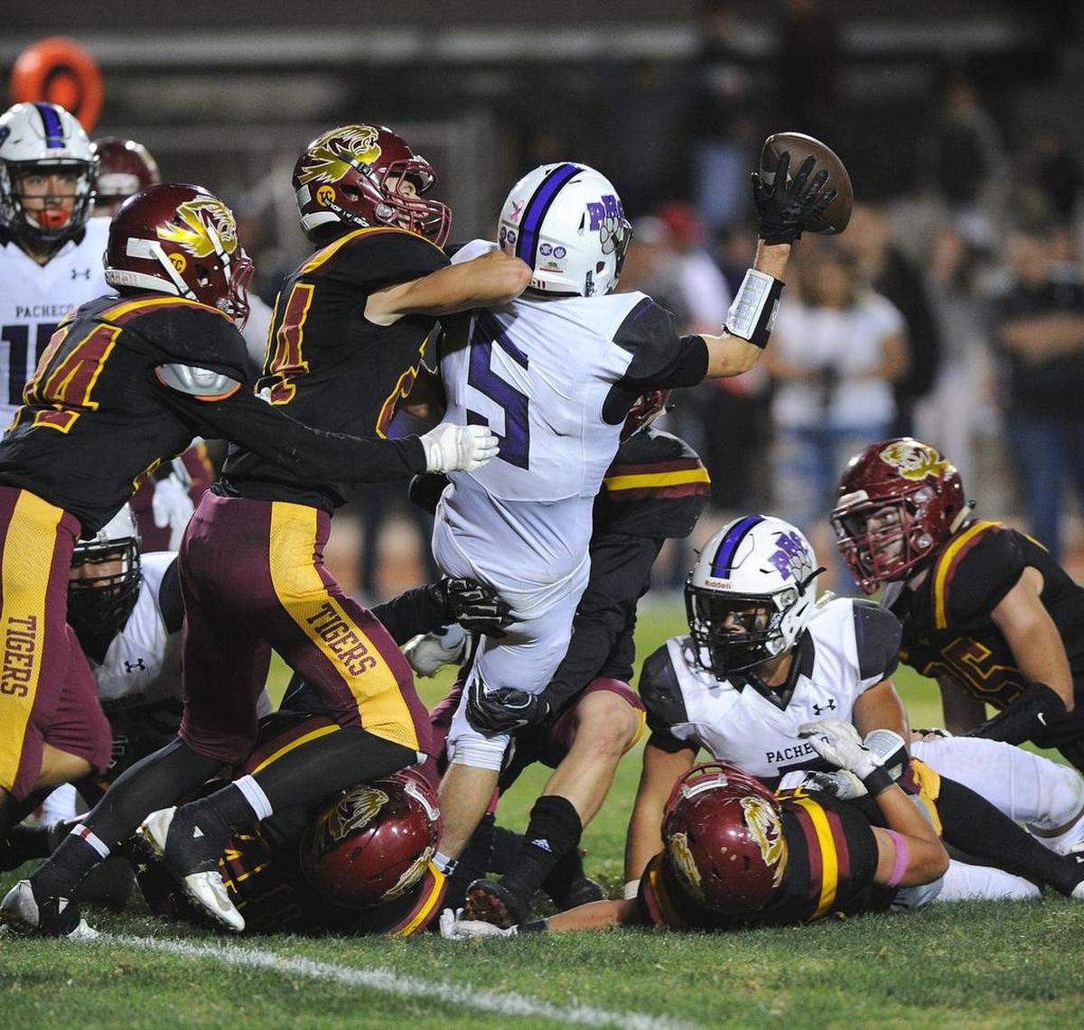Pacheco wide receiver, Michael Farias is sacked after recovering a fumbled snap on fourth and goal at the three yard line by Los Banos’ Bryant Camp on the final play of the game Oct. 26, 2018 at Loftin Stadium in Los Banos.