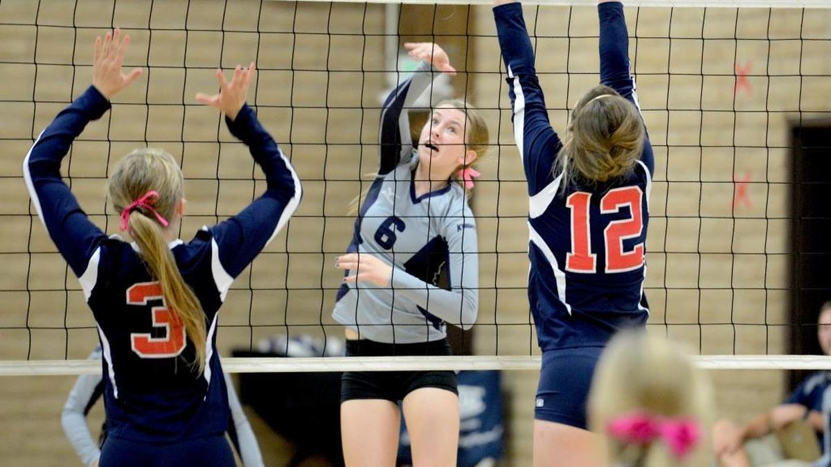 
Aubriana Vander Woude (6) splits the Turlock Christian block with a kill. Vander Woude had a team-high 13 in a Stone Ridge Christian 3-0 win over TC. Monday, Oct. 12, 2015 in Merced.

