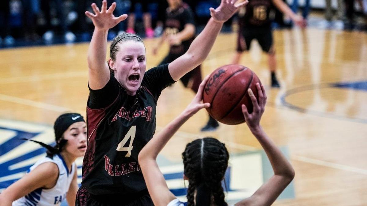 Golden Valley senior Stephanie Moore (4) attempts to block an Atwater pass during a game at Atwater High School in Atwater, Calif., Thursday, Jan. 14, 2016. The Cougars will open the Sac-Joaquin Section Division I playoffs at home against Franklin of Elk Grove on Tuesday.