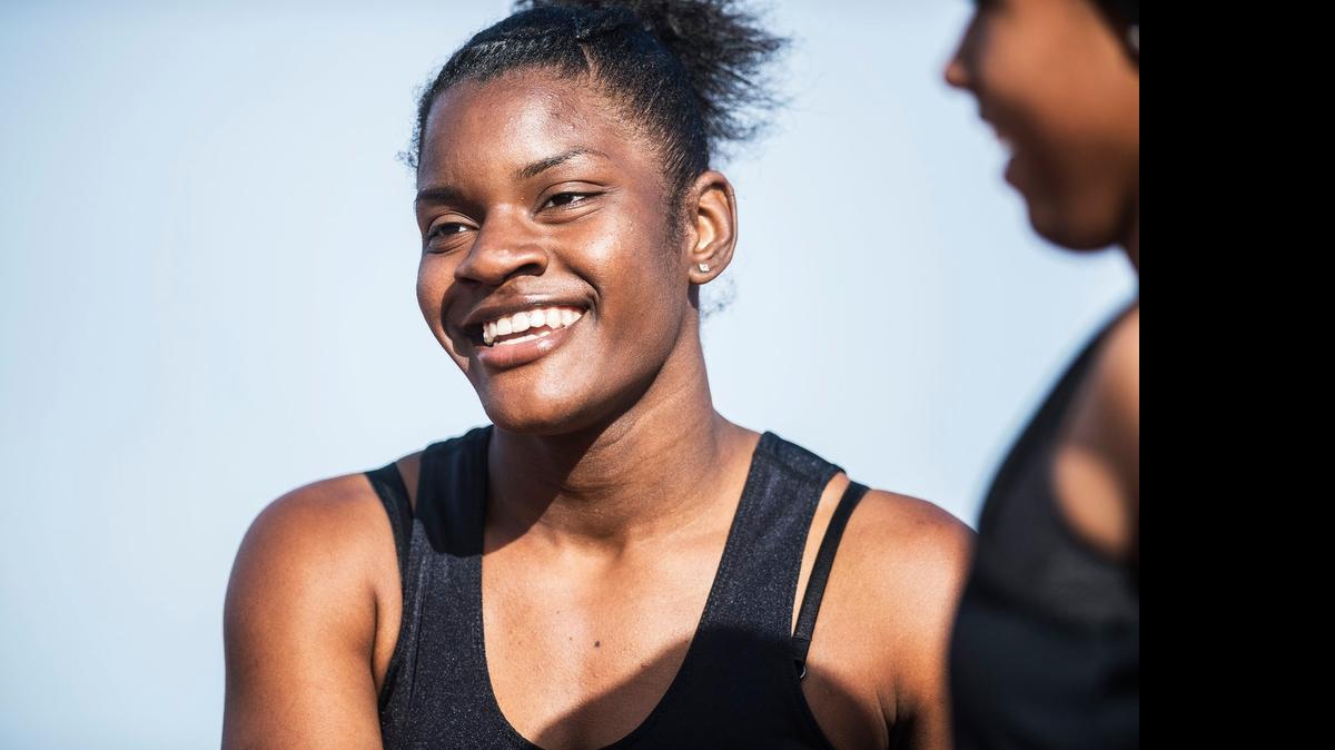 
Buhach Colony senior Brandy Coward smiles after winning the girls 200-meter dash during the Central California Conference Center Meet at Veterans Stadium at Golden Valley High School in Merced on Wednesday, April 1, 2015.
