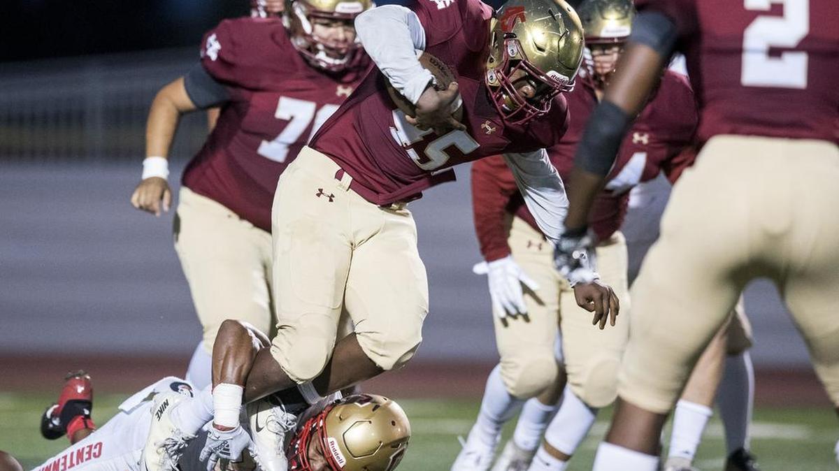 Golden Valley senior Davon Johnson (45) is tripped up while rushing the ball during a game against Centennial earlier this season. Johnson recorded five sacks in the Cougars’ 21-0 win over El Capitan on Friday night.