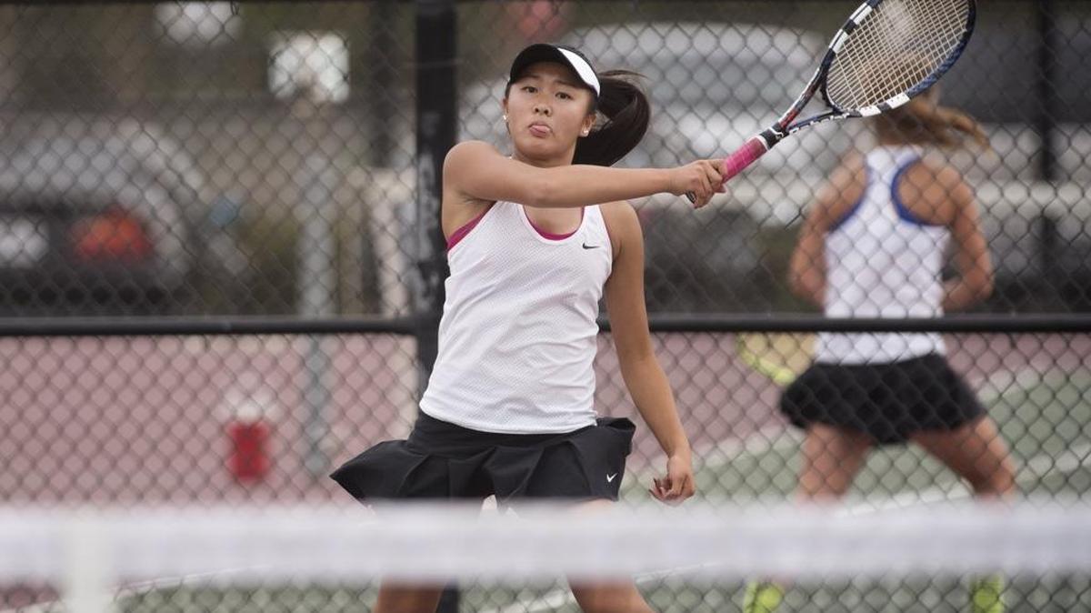 
Los Banos No. 1 singles player Shirley Liu strikes a forehand Tuesday in her match with Central Valley's Teresa Ruiz, below.
