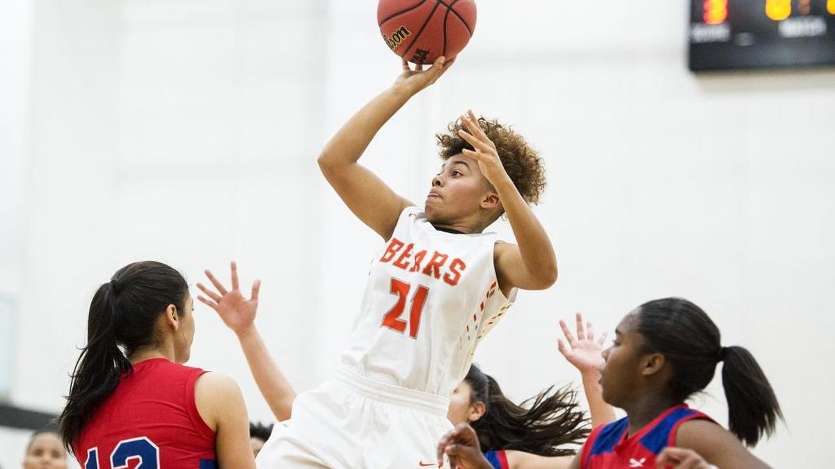 Merced sophomore Sierra Smith (21) attempts a jump shot during a game against Atwater at Merced High School in Merced, Calif., on Tuesday, Jan. 16, 2018. The Bears beat the Falcons 68-51.