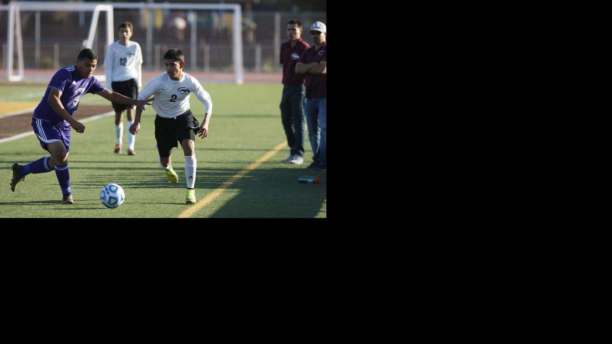 
Livingston’s Daniel Vega and Weston Ranch’s Francisco Garcia vy for the ball during Saturday’s Sac-Joaquin Section Division IV championship game at Stagg High in Stockton.
