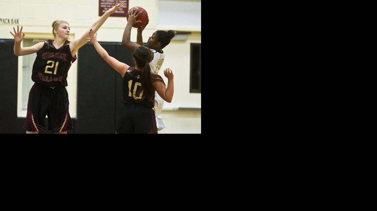 Golden Valley’s Abbee Croninger, left, defends against Buhach Colony’s Brandy Coward during the Cougars’ 50-41 victory Thursday.