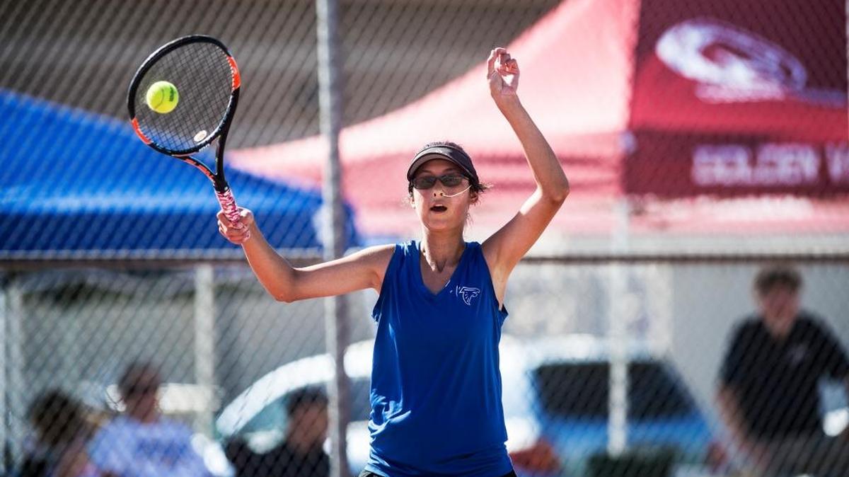 Atwater High School’s Catrina Velarde strikes the ball along the baseline during a singles match against Turlock High School’s Rebekka Cripe in the Central California Conference Singles Championship held Thursday at Golden Valley High School in Merced.