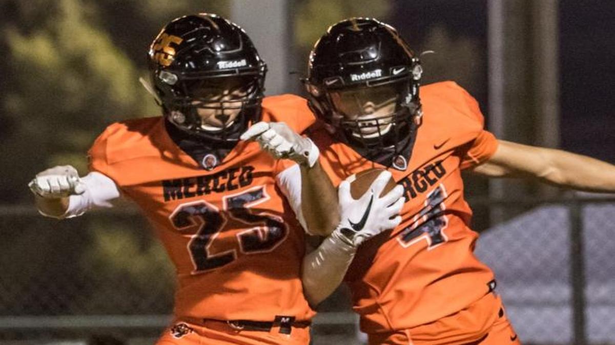 Merced receiver Ezra Morales (4) celebrates a touchdown catch with teammate Jonathan Soriano earlier this season. Morales caught two touchdowns in the Bears’ 50-47 loss to Pitman on Friday night.