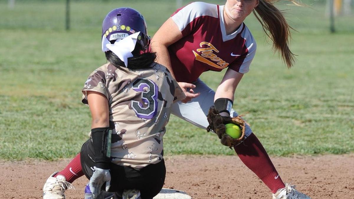 Los Banos shortstop Ali Waltman, right, is late with a tag as Pacheco’s Alia Garcia slid safely back into second. Garcia would be the Panthers’ only runner in the Tigers’ 8-0 victory. At Pacheco High School Tuesday, April 12, 2016.
