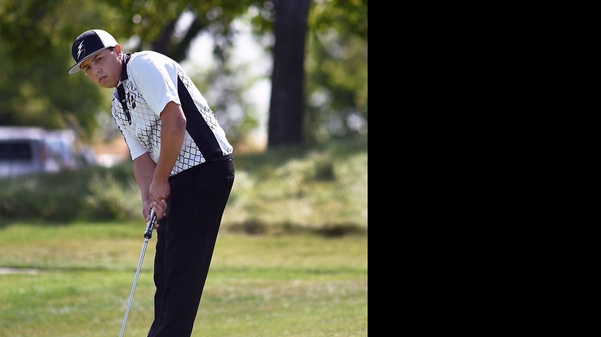 
Emie Ochoa with Buhach Colony putts on the ninth hole on Monday morning (05-11-15) at The Reserve At Spanos Park in Stockton, Calif. during the CIF Sac-Joaquin Section Masters Golf Championships.
