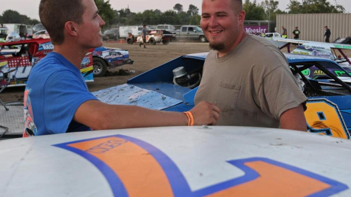 Garrett Corn, left, and Kodie Dean, right talk about the fun they are having racing this season in the Hobby Stock division. Dean leads Corn by six points for the championship going into this Saturday's season finale. Photo by Mike Adaskaveg