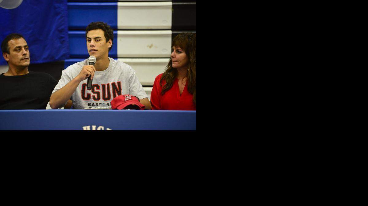 
Atwater High School senior baseball player Derek Molina speaks to the crowd after signing a letter of intent to accept a baseball scholarship to California State University, Northridge inside the Atwater High School gymnasium in Atwater, Calif., Wednesday, Nov. 12, 2014.
