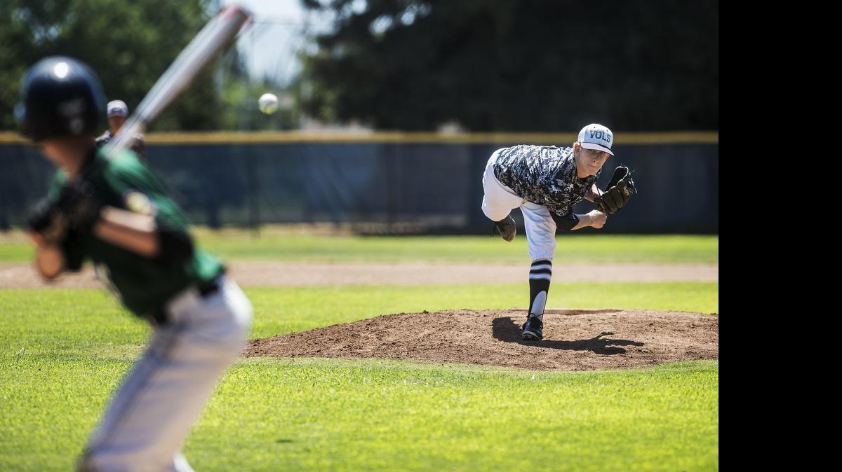 
Merced Volunteers pitcher Mitchell Miller (24) delivers a pitch during a game against Ed Stewart Post 803 in the American Legion Baseball Area 3 Tournament at Merced College in Merced, Calif., Saturday, July 25, 2015. The Volunteers won the game 6-1.

