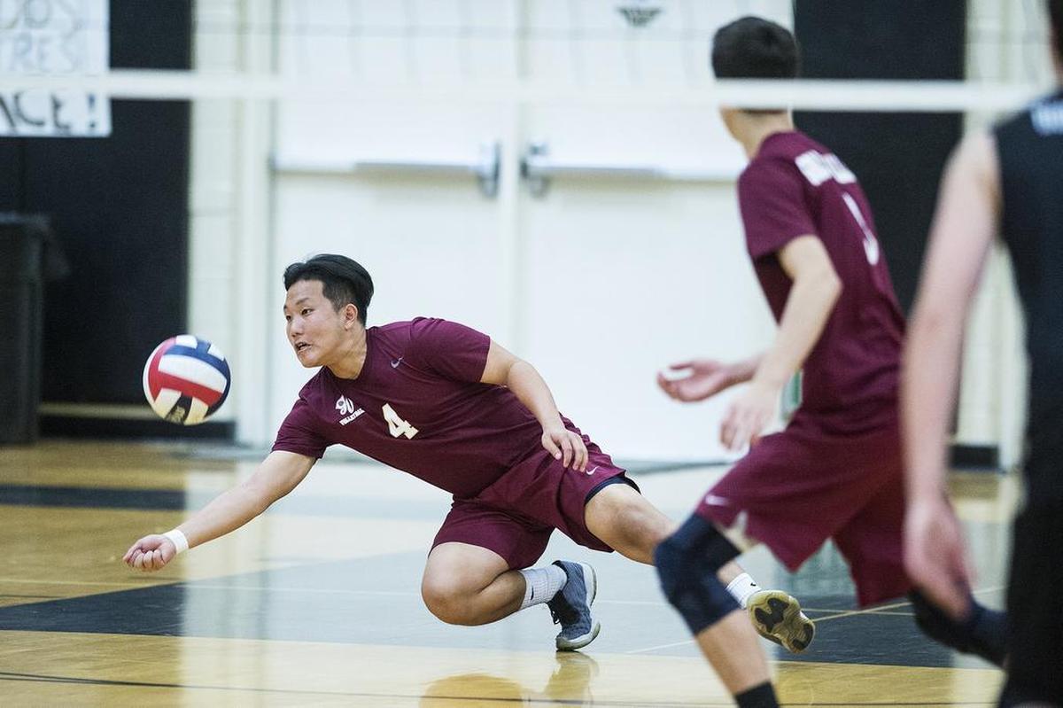 Golden Valley senior Gary Vang (4) dives for the ball during a match against Buhach Colony at Buhach Colony High School in Atwater, Calif., on Thursday, April 26, 2018. The Cougars beat the Thunder 3-0.