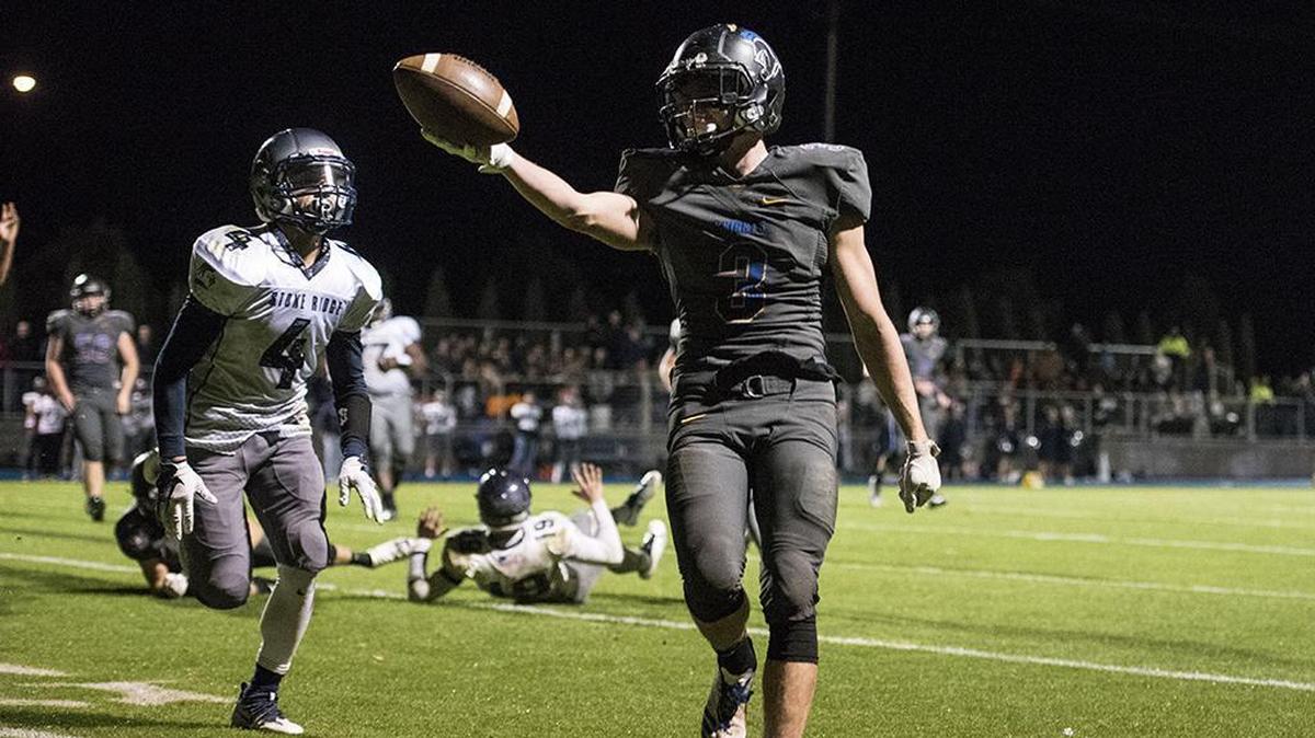 Ripon Christian junior Michael Kamps (3) extends the ball over the goal line to score a touchdown during a game in the 2017 season.