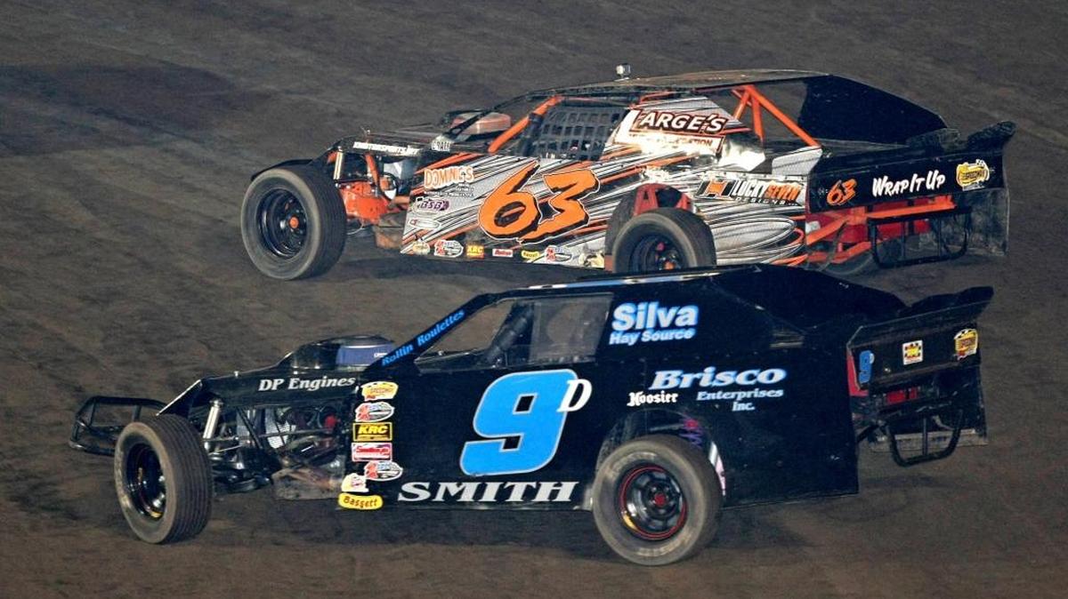 The 9D races in 2013, when Bob Smith and John Fore, Jr. shared driving of the car they partnered in. Here, the 9D takes on Matt Sotomayor (63) going out of the second turn of the Merced Speedway. Staff photo by Mike Adaskaveg.