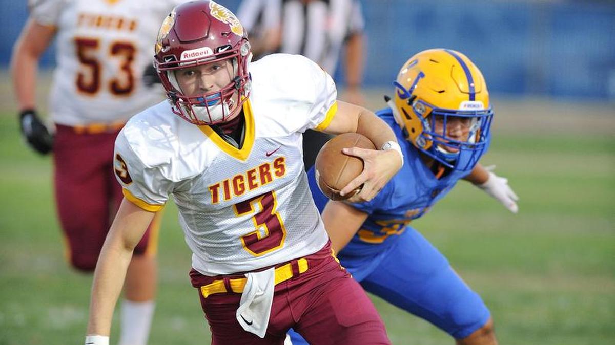 Los Banos quarterback, Colby Copp looks for an opening in the first quarter against Dos Palos Friday night, Aug. 17, 2018 in Dos Palos.