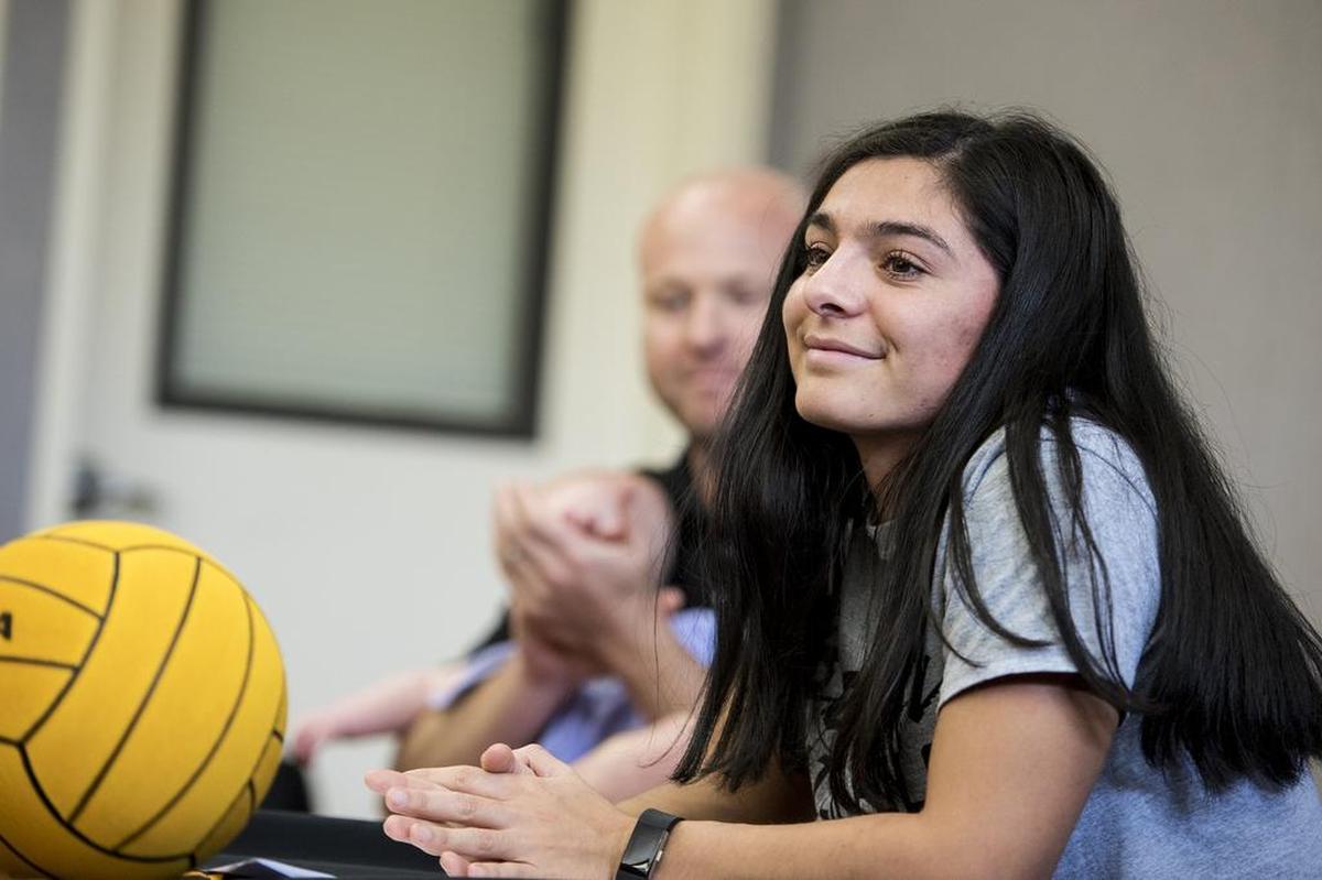 Buhach Colony senior Pamela Solano smiles as she looks to family and friends during a ceremony at Buhach Colony High School in Atwater, Calif., on Wednesday, April 11, 2018. Solano has verbally committed to play water polo at California State University, Long Beach.
