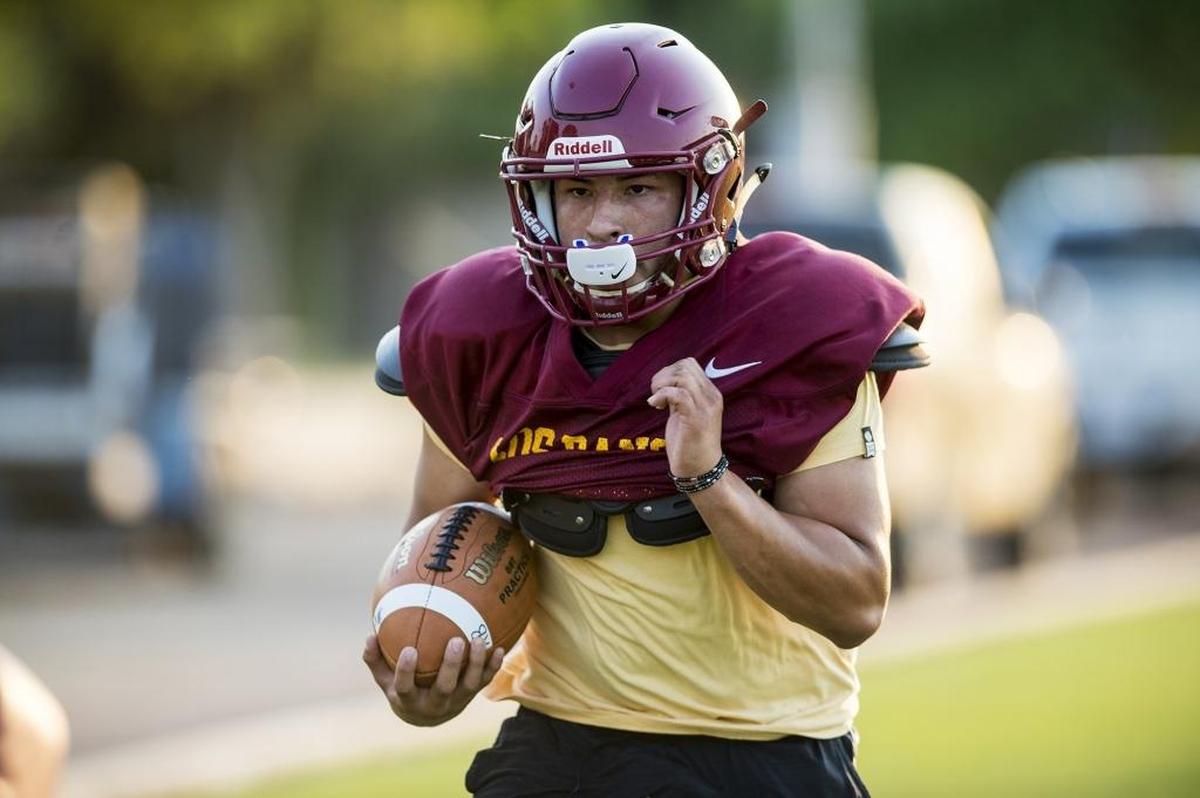 Los Banos High School’s Antonio Lopez runs through drills during football practice at Loftin Stadium in Los Banos, Calif., on Thursday, July 26, 2018.