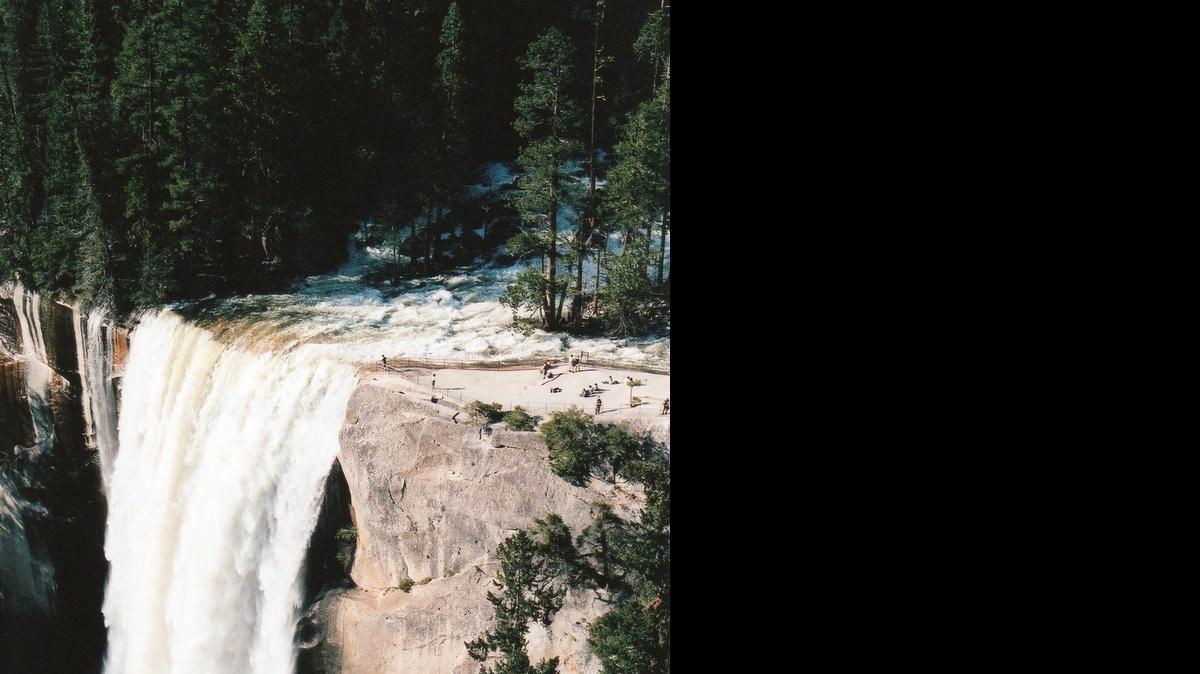 Water crashes over the Vernal Fall at Yosemite.