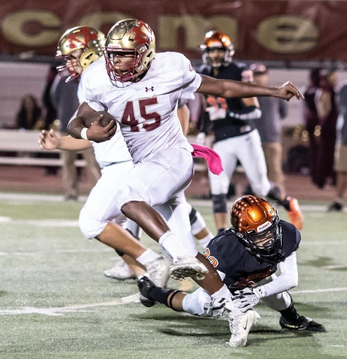Golden Valley running back Davon Johnson runs through a tackle during Friday night’s 25th annual Battle for the Mayor’s Cup. Johnson rushed for 106 yards for the Cougars.