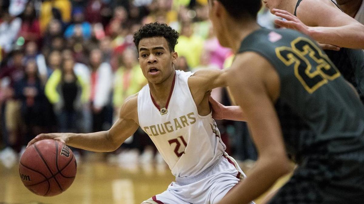 Golden Valley junior Avery Townsel (21) dribbles through the paint during a game against El Capitan earlier this year. Townsel scored 13 points against Atwater on Wednesday night to help the Cougars clinch the outright CCC championship.