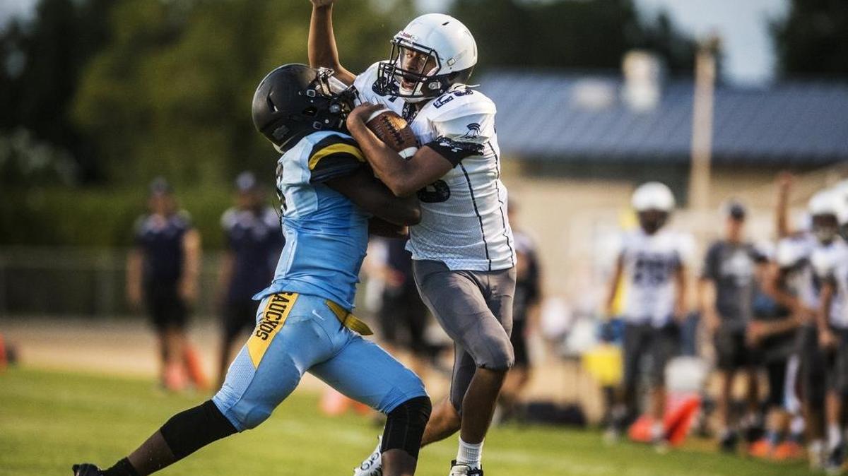 
Stone Ridge Christian running back Shane Casillas (25) is brought down by El Capitan strong safety Da'vonya Shepherd (6) at Stadium '76 at Merced College in Merced, Calif., Friday, Aug. 28, 2015. The Knights beat the Gauchos 40-34 in overtime.
