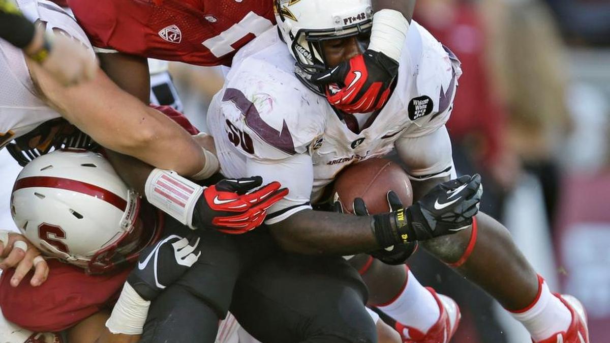 Stanford defensive end and Buhach Colony alum Aziz Shittu, top, hopes to hear his name called this weekend at the 2016 NFL draft.