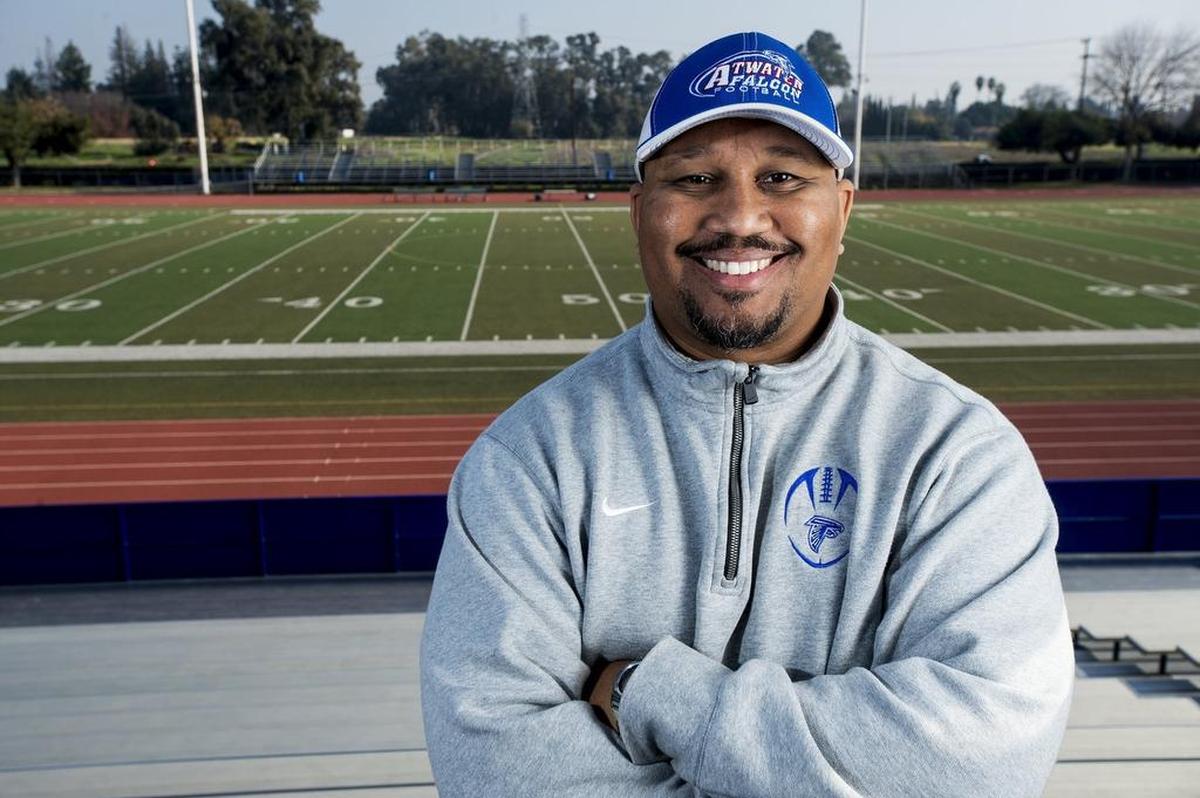 Seneca Ybarra, Atwater High School’s new head football coach, poses for a portrait at the school’s football field in Atwater, Calif., on Thursday, Dec. 22, 2016.