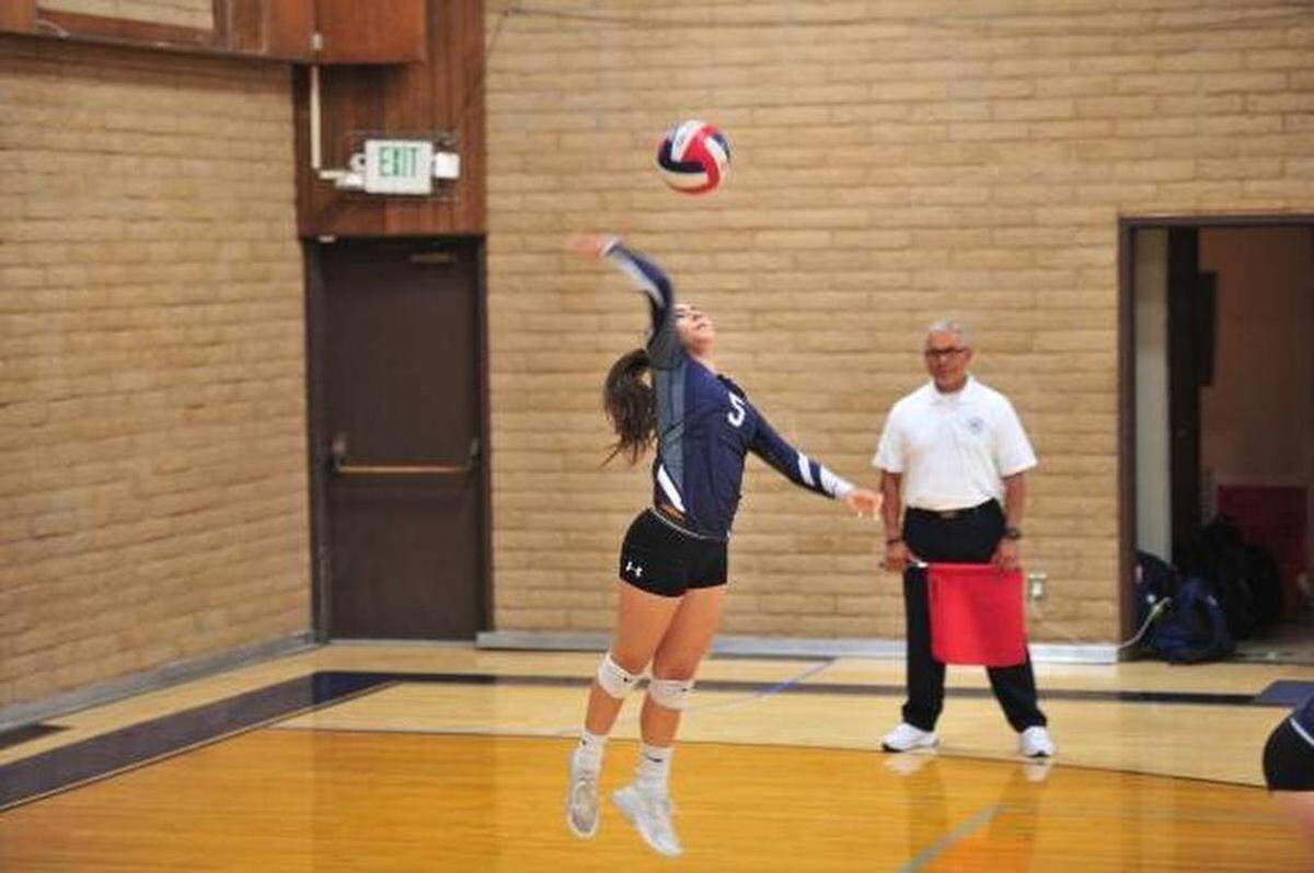 Stone Ridge Christian junior Brooke Wareham serves against Redding Christian on Saturday, Nov. 10, 2018. Wareham has been seizure-free for seven months.