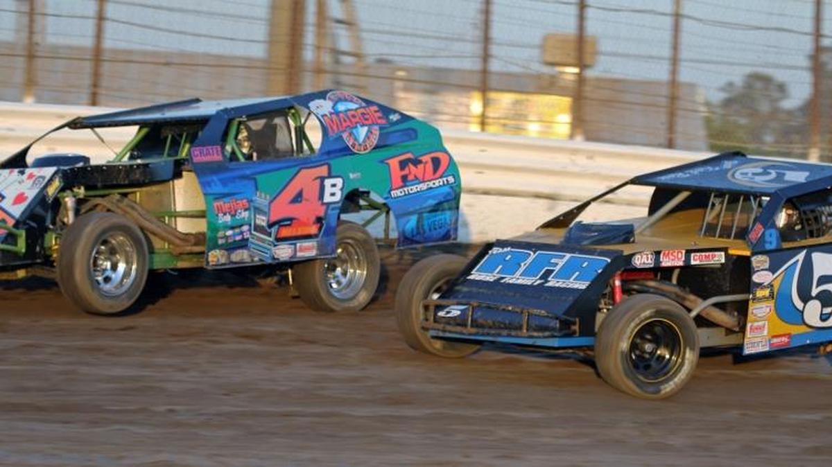 Rookie Bruce “Bubba” Nelson (4) races Karl Rose in the IMCA Modified division July 2 at Merced Speedway.