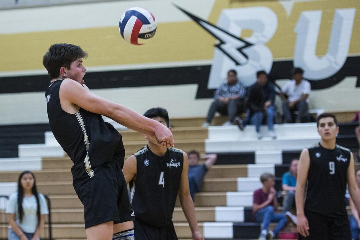 Buhach Colony freshman Andrew Hill (5) hits the ball during a match against Golden Valley at Buhach Colony High School in Atwater, Calif., on Thursday, April 26, 2018. The Cougars beat the Thunder 3-0.