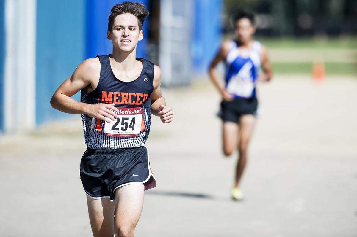 Merced’s Cole McKain, front, leads Atwater’s Raul Flores, during a Central California Conference center meet last season. McKain went undefeated in the three CCC center meets this year.