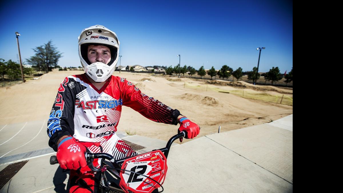 
Caleb Alonozo, 21, of Merced, poses at the Atwater BMX track in Atwater,on Wednesday. Alonzo will be traveling to Heusden-Zolder, Belgium to compete in the UCI BMX World Championships.

